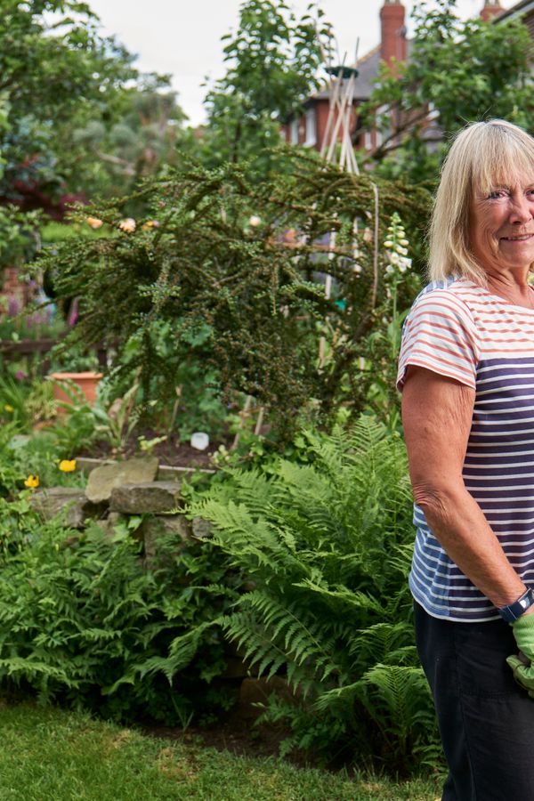 A participant enjoying gardening outdoors